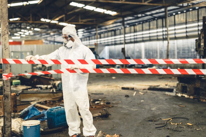 Delta dm worker in ppe safety suit with area closed barrica 2023 11 27 04 57 10 utc small