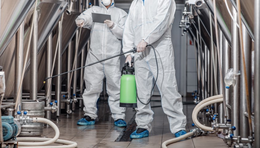 Delta dm workers in protective suits with spray bag and tab 2023 11 27 05 18 58 utc small
